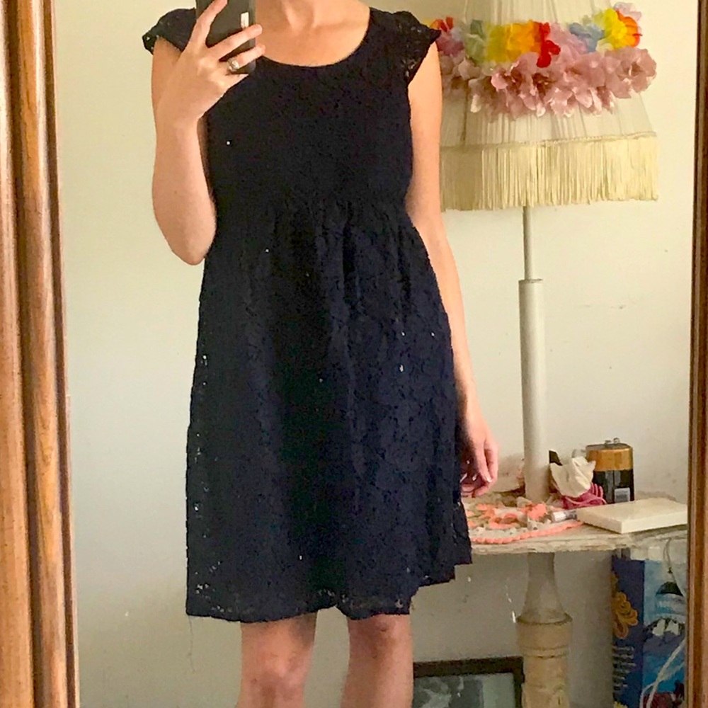 Navy Seraphine maternity lace cap sleeve dress.
